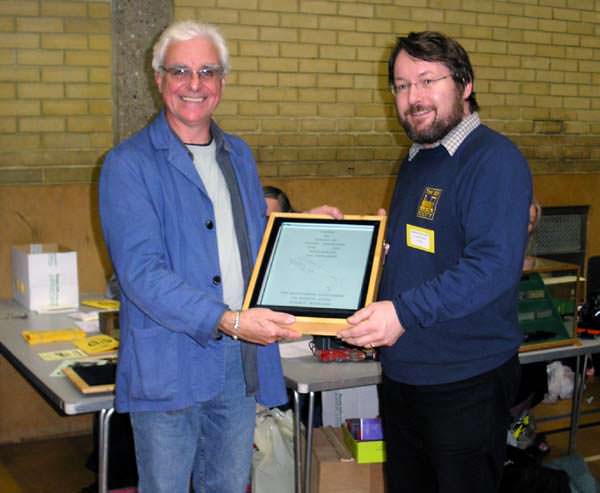 John Bruce is presented the 2004 Reinier Hendriksen Trophy by Chris O'Donoghue - Image © Mick Thornton