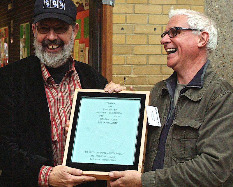 Henk Wust is presented the 2011 Reinier Hendriksen Trophy by Chris O'Donoghue