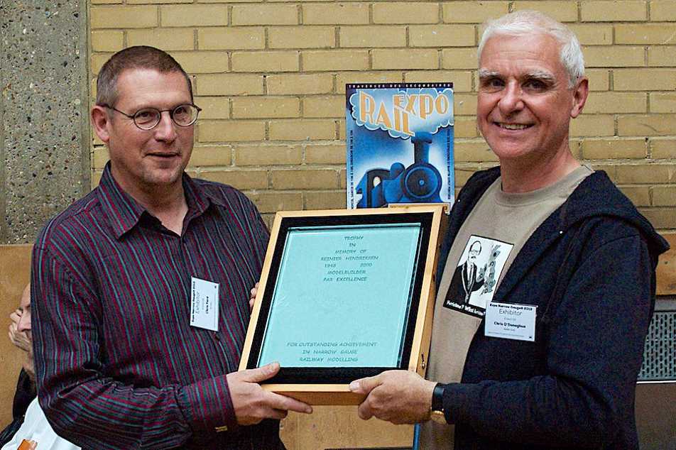 Chris Ford is presented the 2013 Reinier Hendriksen Trophy by Chris O'Donoghue