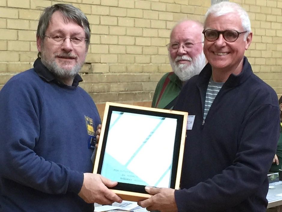 John Bruce is presented the 2015 Reinier Hendriksen Trophy by Chris O'Donoghue