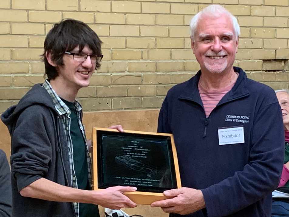 Jamie Warne is presented the 2019 Reinier Hendriksen Trophy by Chris O'Donoghue